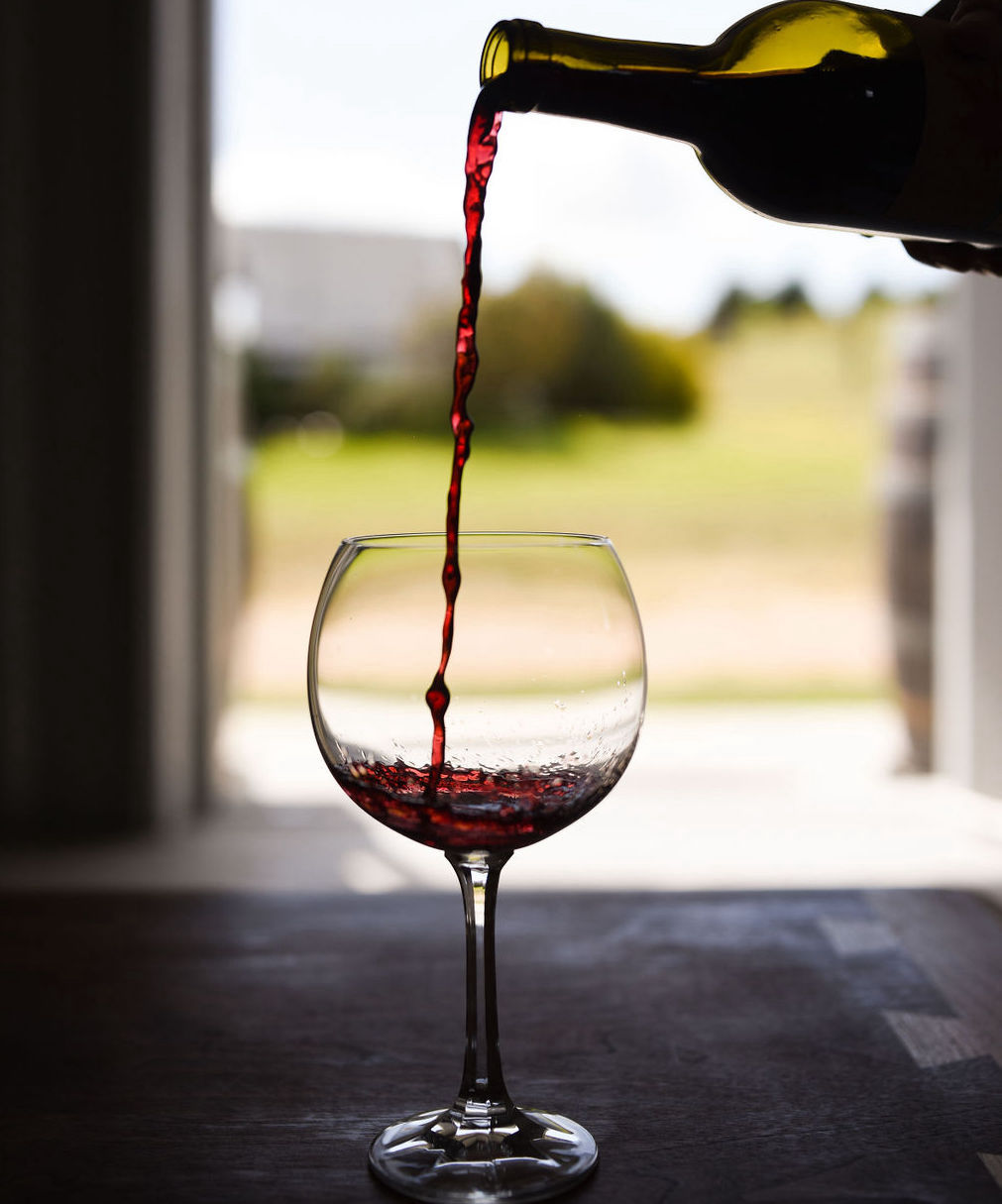 Majek Vineyard wine being poured into a glass
