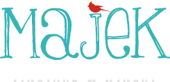 Majek Vineyard & Winery Scrolled light version of the logo (Link to homepage)
